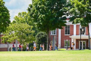 Students in the distance, walking on campus