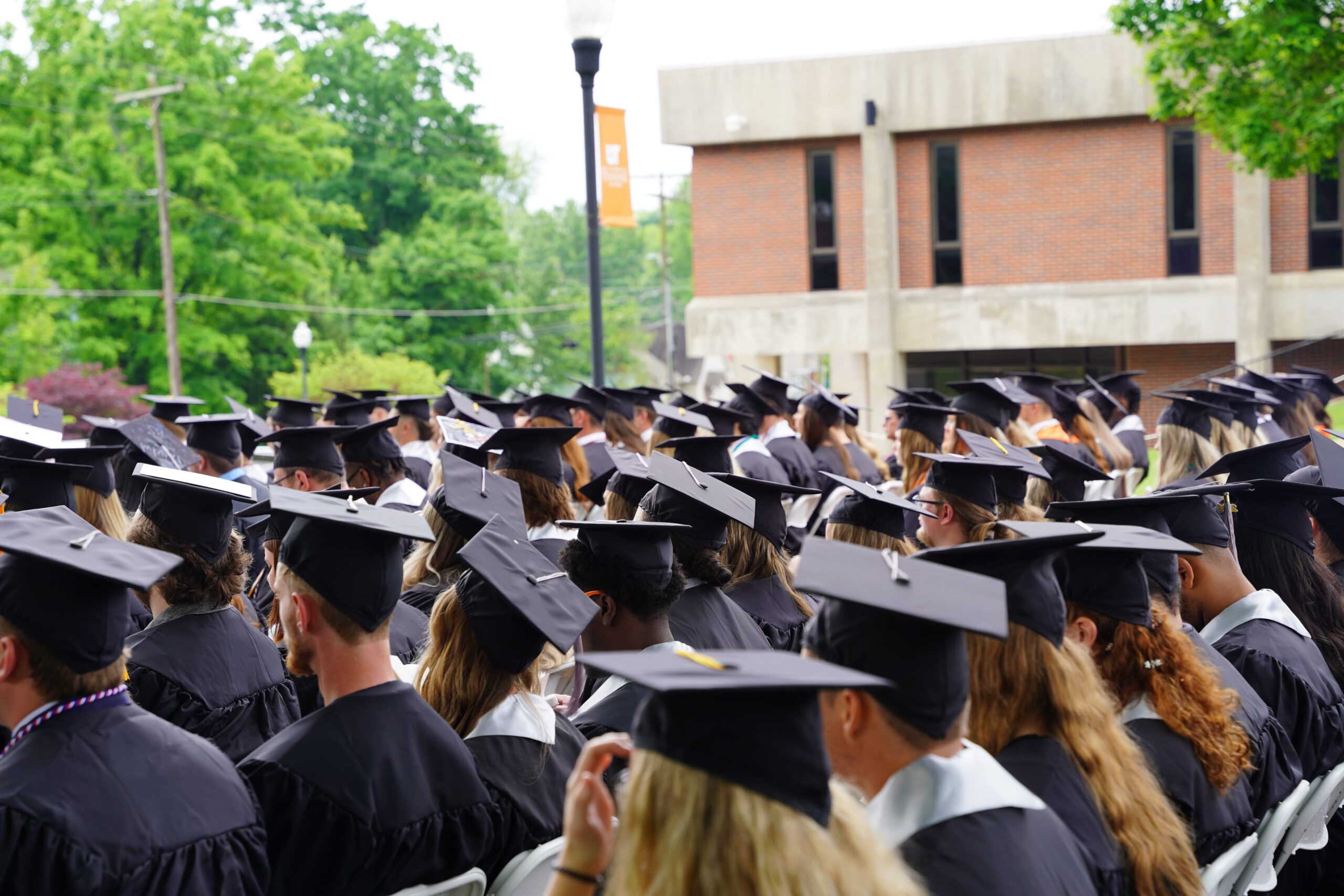 An aerial shot of grads in caps and gowns