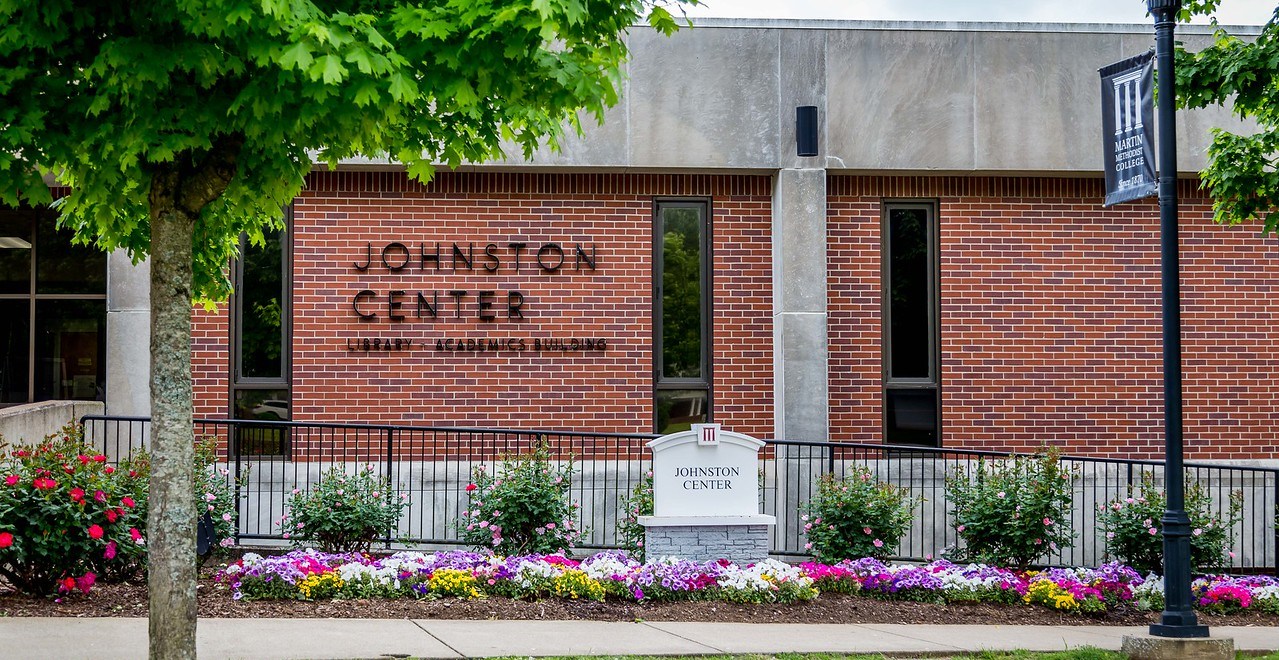 front of the Warden memorial library with text reading "Johnson Center" on the side