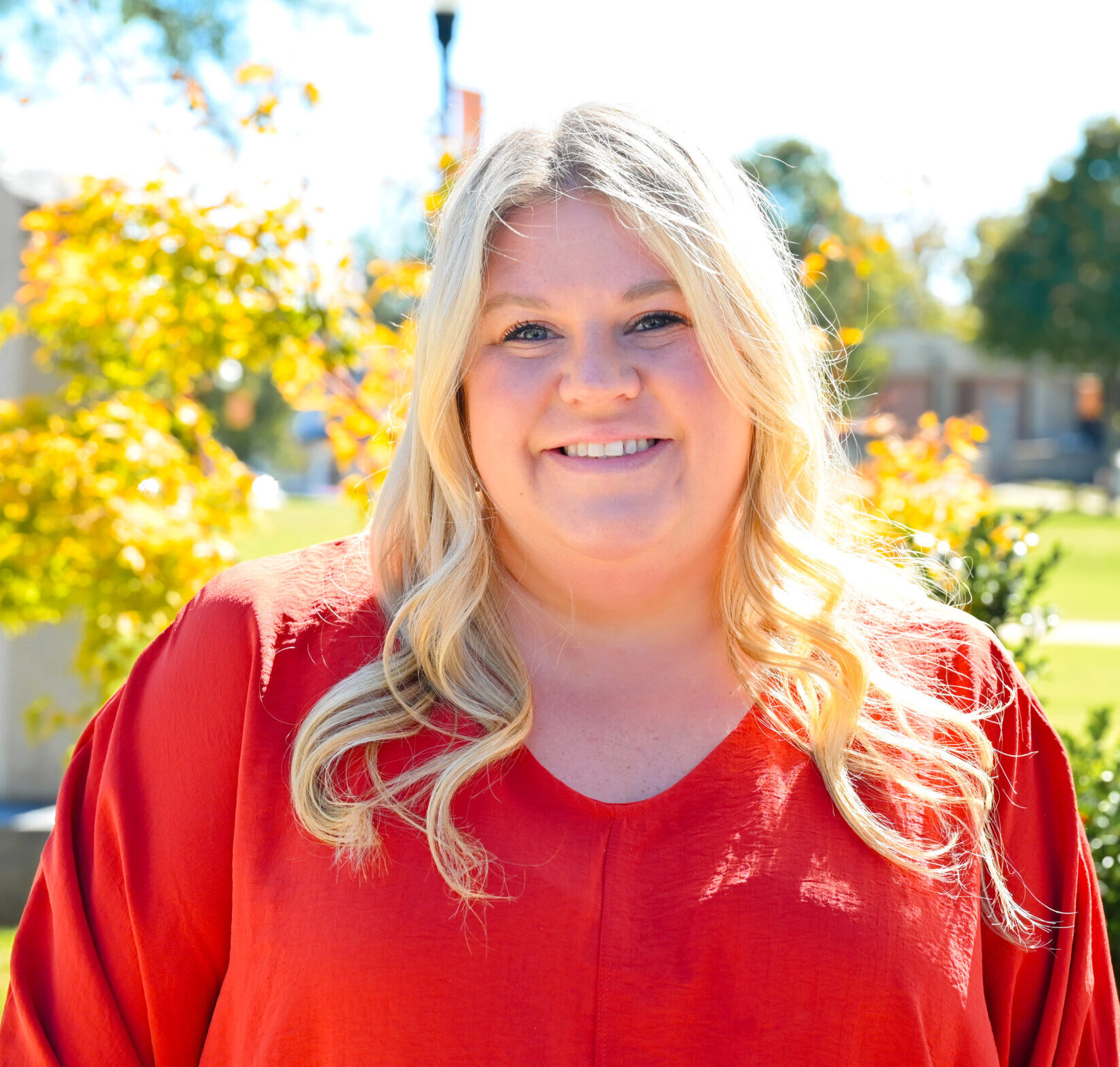 Lindsey Braden poses for a headshot on the green.