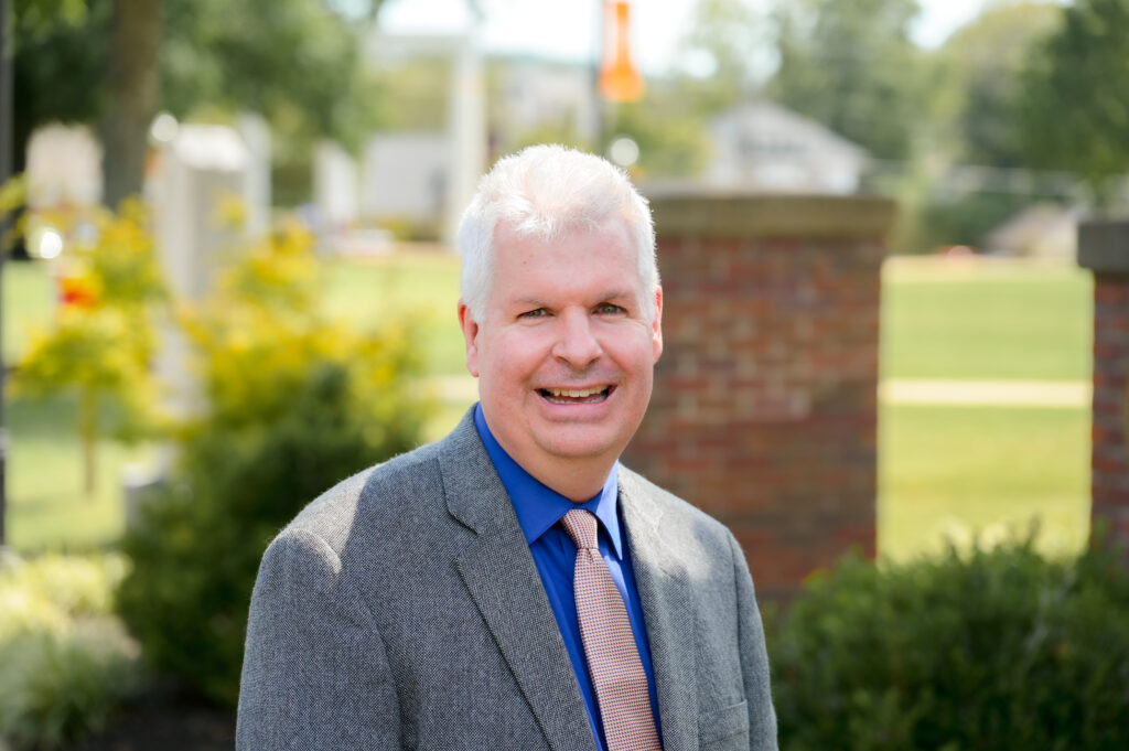 Portrait picture of Todd Jones on the campus green