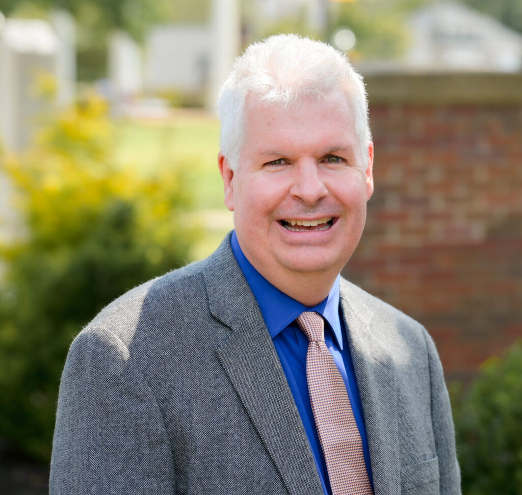 Portrait picture of Todd Jones on the campus green