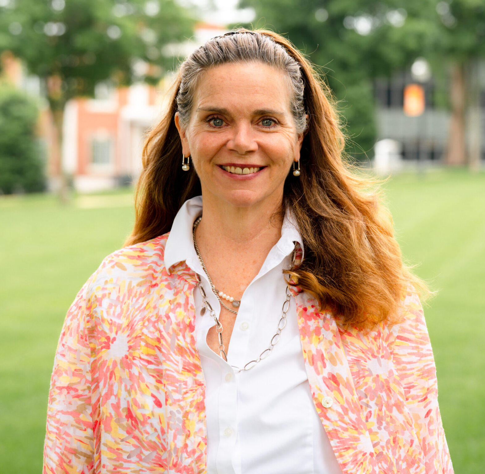 Lawrence Hudson posing for a headshot on the campus green.