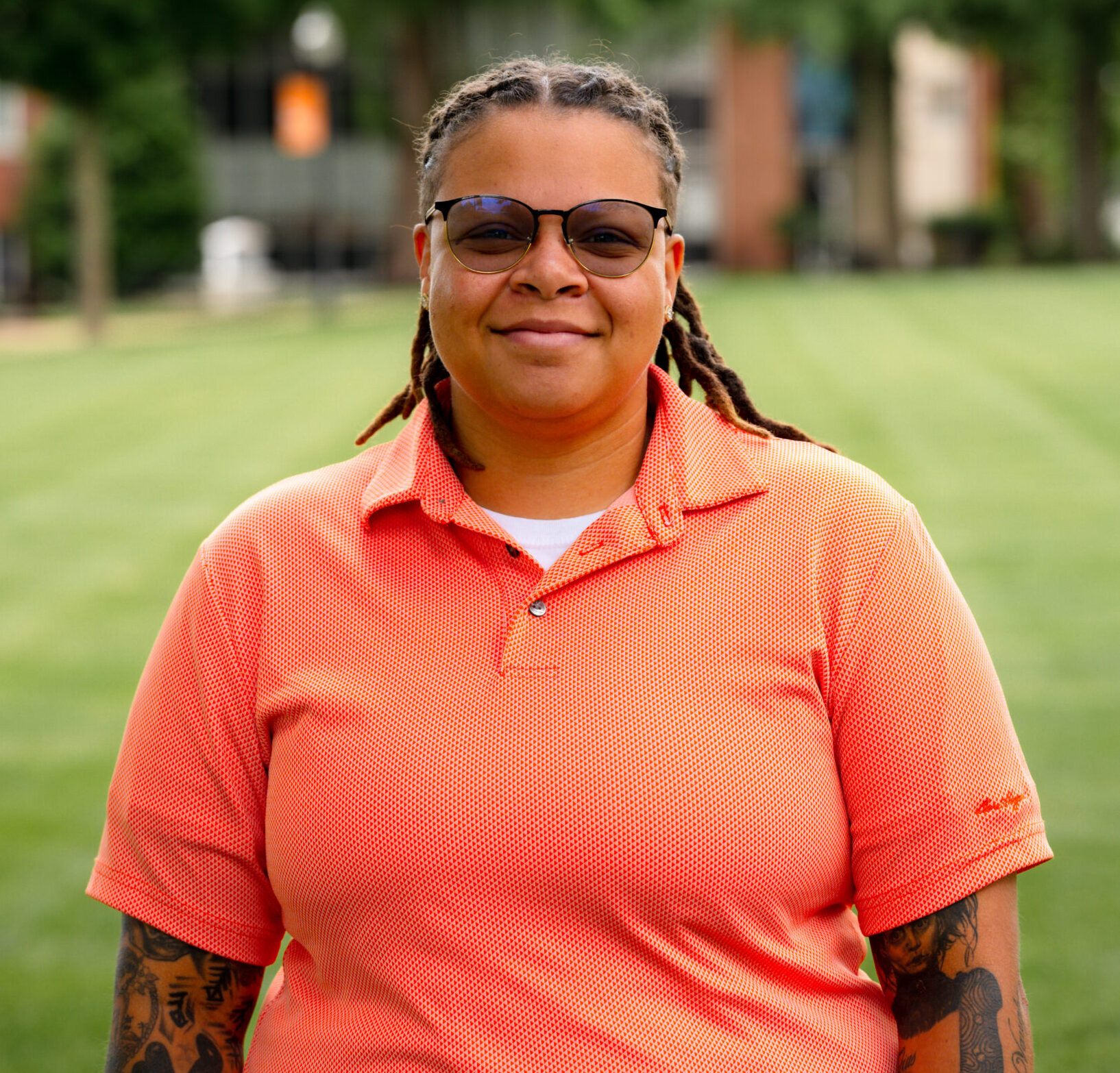 KeNisha Reed posing for a headshot on the campus green.
